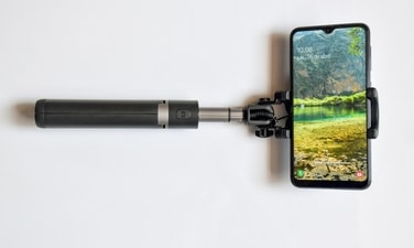 With the help of a selfie stick, you can click great pictures with help. (Pexels)