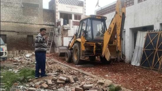In Zone D, the Ludhiana MC demolished the illegal second floor of a commercial building on College Road, sealed two commercial shops in Ghumar Mandi and on Chaar Khamba Road in Model Town, razed a colony in Jawaddi, and removed encroachment on a portion of the road by a home owner in Model Town Extension. (HT Photo)