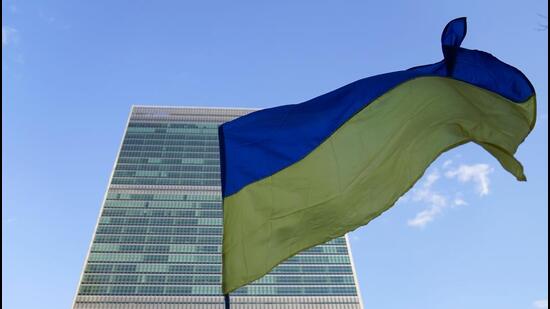 People rally in support of Ukraine outside the United Nations headquarters in New York on February 27. (AP Photo)