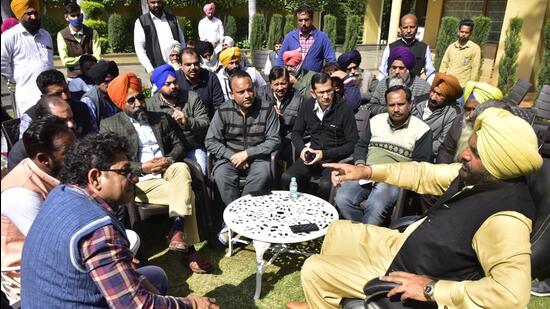 Member of Parliament Gurjeet Singh Aujla (R) with family members of students from Punjab who are stranded in Ukraine, in Amritsar on Monday. (Sameer Sehgal /HT)