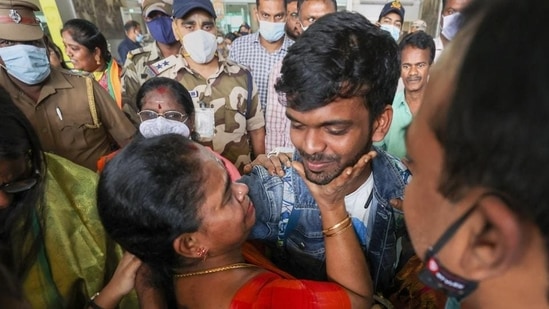 Parents greet their children, evacuated from crisis-hit Ukraine, upon their arrival at the airport, in Chennai on Sunday. (PTI)