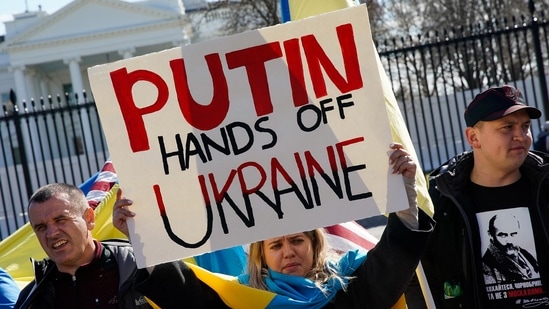 A demonstrator holds up a sign during a "Stand with Ukraine" rally against the Russian invasion of Ukraine, in front of the White House in Washington, U.S., February 28, 2022.&nbsp;(REUTERS)