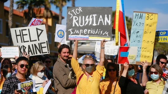 Demonstrators gather to rally in support of Ukraine in Santa Monica, California, on February 27, 2022.(AFP)