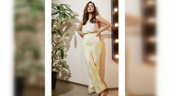 Yami Gautam decided to keep it mellow but chic in a double strap white top which she tucked in her high-rise white denim.(Instagram/@yamigautam)