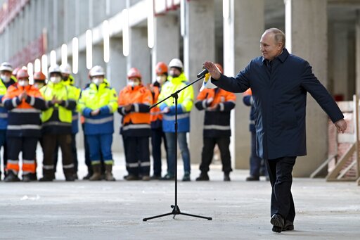 Russian President Vladimir Putin gestures as he leaves the construction site of the National Space Agency in Moscow. (AP) Russian President Vladimir Putin gestures as he leaves the construction site of the National Space Agency in Moscow. (AP)