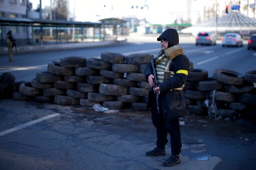 A civil defenseman stands at a checkpoint in Kyiv, Ukraine, Saturday. (AP) A civil defenseman stands at a checkpoint in Kyiv, Ukraine, Saturday. (AP)