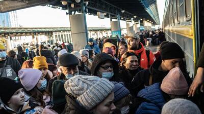 Displaced Ukrainians seeking to leave the capital city board a train at Kyiv central train station in Kyiv, Ukraine, on Sunday. (Bloomberg) Displaced Ukrainians seeking to leave the capital city board a train at Kyiv central train station in Kyiv, Ukraine, on Sunday. (Bloomberg)