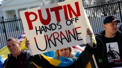 A demonstrator holds up a sign during a "Stand with Ukraine" rally against the Russian invasion of Ukraine, in front of the White House.&nbsp; (REUTERS)