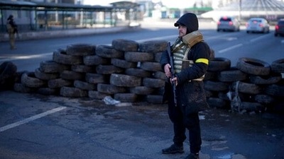 A civil defenseman stands at a checkpoint in Kyiv, Ukraine. (AP) A civil defenseman stands at a checkpoint in Kyiv, Ukraine. (AP)