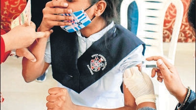 Prayagraj, Feb 10 (ANI): A student reacts while receiving a dose of COVAXIN against COVID-19 disease during a vaccination drive, at a government school, in Prayagraj on Thursday. (ANI Photo) (Nitin Sharma) Prayagraj, Feb 10 (ANI): A student reacts while receiving a dose of COVAXIN against COVID-19 disease during a vaccination drive, at a government school, in Prayagraj on Thursday. (ANI Photo) (Nitin Sharma)