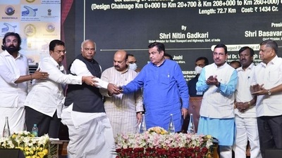 Union Minister for Road Transport & Highways Nitin Gadkari asked Chief Minister Basavaraj Bommai, who was present on the dais, to speed up acquisition of land to take up new projects. (PTI) (PTI) Union Minister for Road Transport & Highways Nitin Gadkari asked Chief Minister Basavaraj Bommai, who was present on the dais, to speed up acquisition of land to take up new projects. (PTI) (PTI)
