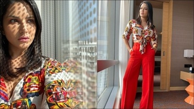 The pictures featured the diva donning a half sleeves white shirt that sported multi-coloured animated prints all over. Buttoned down at the front, the shirt from Debu's was knotted at the waist to add to the hotness quotient. (Instagram/sunnyleone) The pictures featured the diva donning a half sleeves white shirt that sported multi-coloured animated prints all over. Buttoned down at the front, the shirt from Debu's was knotted at the waist to add to the hotness quotient. (Instagram/sunnyleone)