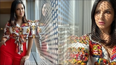 With the lockdown lifting and oodles of travel ahead of us, Bollywood hottie Sunny Leone lays fashion cues for jet-setters on how to look stylish while travelling and take travel attire to new heights in an eye-catching ‘jungle safari’ crop top with a pair of red pants. (Instagram/sunnyleone) With the lockdown lifting and oodles of travel ahead of us, Bollywood hottie Sunny Leone lays fashion cues for jet-setters on how to look stylish while travelling and take travel attire to new heights in an eye-catching ‘jungle safari’ crop top with a pair of red pants. (Instagram/sunnyleone)