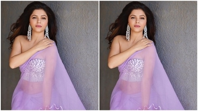 Rubina chose statement silver earrings adorned with beads to accessorise the contemporary saree look. In the end, open locks with curled ends, blush pink lip shade, silver eyeliner, subtle eye shadow, heavy mascara on the lashed, blushed cheeks, dewy base, and sharp contouring rounded off the glam picks. (Instagram/@rubinadilaik) Rubina chose statement silver earrings adorned with beads to accessorise the contemporary saree look. In the end, open locks with curled ends, blush pink lip shade, silver eyeliner, subtle eye shadow, heavy mascara on the lashed, blushed cheeks, dewy base, and sharp contouring rounded off the glam picks. (Instagram/@rubinadilaik)