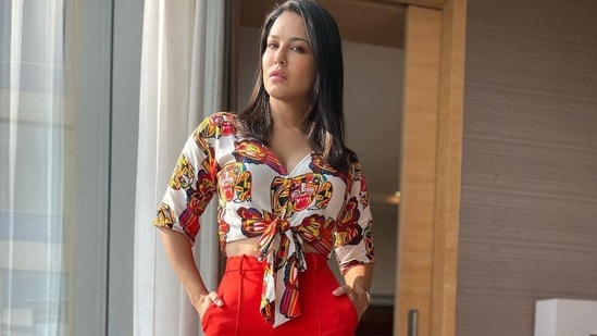 The plunge neckline shirt was teamed with a pair of high-waist bright red wide-legged pants from Bcbgmaxazria, that came with pockets on either sides and belt hoops.&nbsp;(Instagram/sunnyleone)