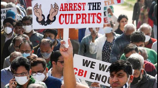 Residents of Chintels Paradiso housing society hold placards during a protest demanding a CBI investigation into the collapse last month in Gurugram. (PTI Archive) Residents of Chintels Paradiso housing society hold placards during a protest demanding a CBI investigation into the collapse last month in Gurugram. (PTI Archive)