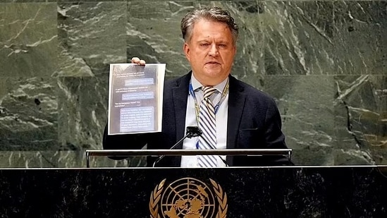 The Ukrainian Ambassador holding up a screenshot of the Russian soldier's text to his mother he claimed to have accessed before the soldier died. (Twitter- CSPAN)