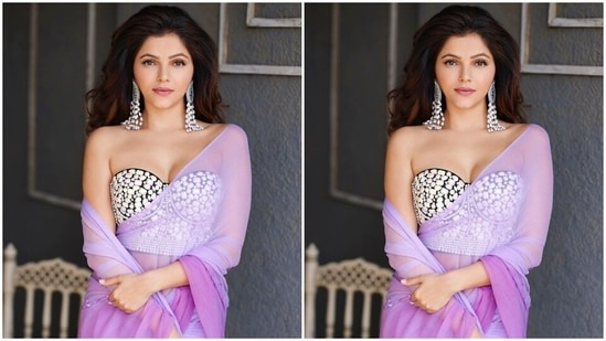 The photos show the star posing in a sheer saree that comes in dual lavender tones. Rubina draped the see-through six yards, embroidered with silver gota patti on the pallu, in traditional style around her body.(Instagram/@rubinadilaik)
