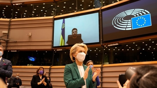 European Commission president Ursula von der Leyen applauds after an address by Ukraine's President Volodymyr Zelenskyy, via video link, during an extraordinary session on Ukraine at the European Parliament in Brussels, Tuesday, March 1, 2022. (AP Photo/Virginia Mayo)