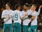 Manchester City's Riyad Mahrez celebrates scoring their first goal with teammates.
