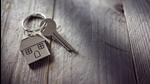 House key on a house shaped keychain resting on wooden floorboards concept for real estate, moving home or renting property (Getty Images/iStockphoto) House key on a house shaped keychain resting on wooden floorboards concept for real estate, moving home or renting property (Getty Images/iStockphoto)