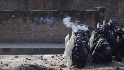 Riot police fires tear gas towards the demonstrators during a protest against the $500 million US infrastructure grant under the Millennium Challenge Corporation (MCC) near the parliament in Kathmandu, Nepal on Sunday. (REUTERS) Riot police fires tear gas towards the demonstrators during a protest against the $500 million US infrastructure grant under the Millennium Challenge Corporation (MCC) near the parliament in Kathmandu, Nepal on Sunday. (REUTERS)