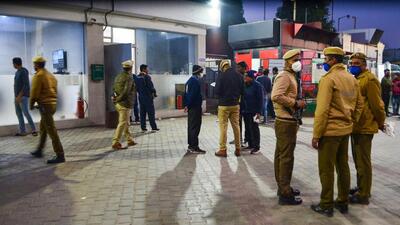 Policemen investigating the triple murder at a CNG gas station on National Highway 48, in Gurugram on Monday. (PTI)