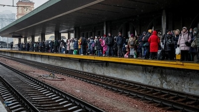 People wait to board an evacuation train from Kyiv to Lviv, at Kyiv central train station, following Russia's invasion of Ukraine, in Kyiv, Ukraine. (REUTERS)