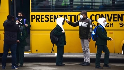 School buses filled with students made way to respective schools across the city and other parts of the valley, officials said. (HT Photo/Waseem Andrabi)