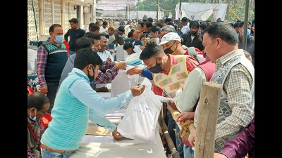 Polling staff at a distribution center to collect polling equipment for the sixth and the penultimate phase of the Uttar Pradesh Assembly Election, in Gorakhpur on Wednesday. (ANI)