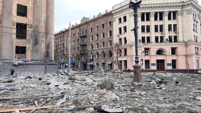 Rescuers remove debris in the regional administration building, which city officials said was hit by a missile attack, in central Kharkiv, Ukraine, Tuesday. (REUTERS)