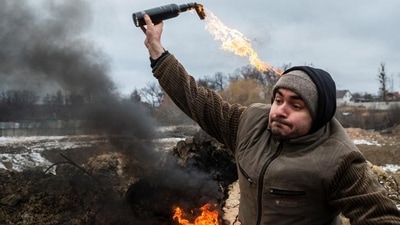 A civilian trains to throw Molotov cocktails to defend the city, in Zhytomyr, Ukraine, Tuesday. (REUTERS)