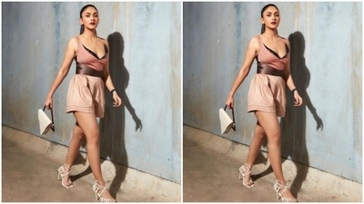 Mrunal aptly accessorised her look for the day with a triangular sling bag from the shelves of Adisee and white stilettos from the house of Public Desire. (Instagram/@mrunalthakur)
