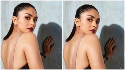 Styled by fashion stylist Shreeja Rajgopal, Mrunal wore her tresses into a clean ponytail and went minimal on the makeup to complement her attire. In nude eyeshadow, mascara-laden eyelashes, drawn eyebrows, contoured cheeks and a shade of bright red lipstick, Mrunal looked just too stunning. (Instagram/@mrunalthakur)