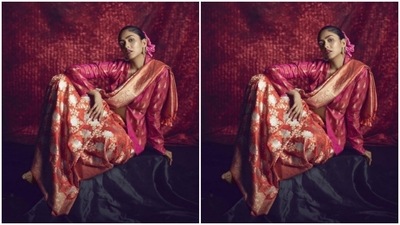 Mrunal paired her benarasi saree with a pink blazer-styled blouse detailed in golden resham threads. (Instagram/@mrunalthakur)