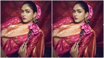 In a ponytail decorated with golden threads and a pink accessory adorning her head, Mrunal looked right out of an ethnic fashion fairytale. (Instagram/@mrunalthakur)