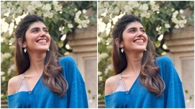 Sanjana's travel fashion always manages to make our hearts skip beats. Here's a picture of Sanjana acing a pastel bralet and a bright blue sweater in Goa. (Instagram/@sanjanasanghi96)