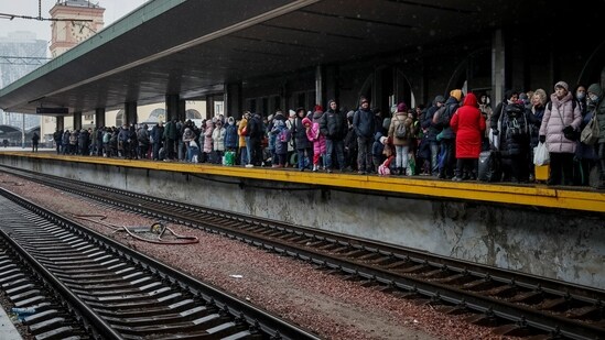 People wait to board an evacuation train from Kyiv to Lviv, at Kyiv central train station, following Russia's invasion of Ukraine, in Kyiv, Ukraine.(REUTERS)