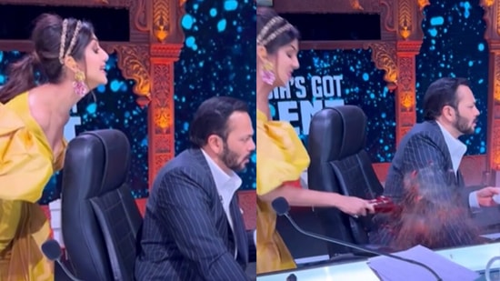 Shilpa Shetty breaks a glass bottle on Rohit Shetty, on the sets of India's Got Talent Season 9.