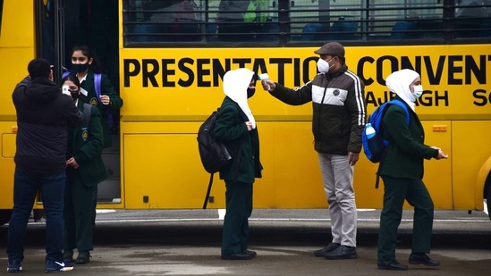 School buses filled with students made way to respective schools across the city and other parts of the valley, officials said.(HT Photo/Waseem Andrabi)