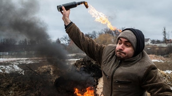 A civilian trains to throw Molotov cocktails to defend the city, in Zhytomyr, Ukraine, Tuesday.(REUTERS)