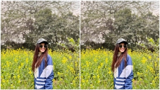 Sanjana surely knows how to stand out, especially in the mustard fields. Sanjana, during her trip to Rajasthan, posed for a picture in a white turtleneck sweater, blue and white track suit and tinted shades.(Instagram/@sanjanasanghi96)
