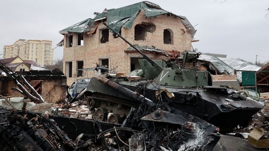 A destroyed armoured vehicle, with the letter "V" painted on its turret, is seen on a street, as Russia's invasion of Ukraine continues, in the town of Bucha in the Kyiv region, Ukraine March 1, 2022. (REUTERS/Serhii Nuzhnenko)