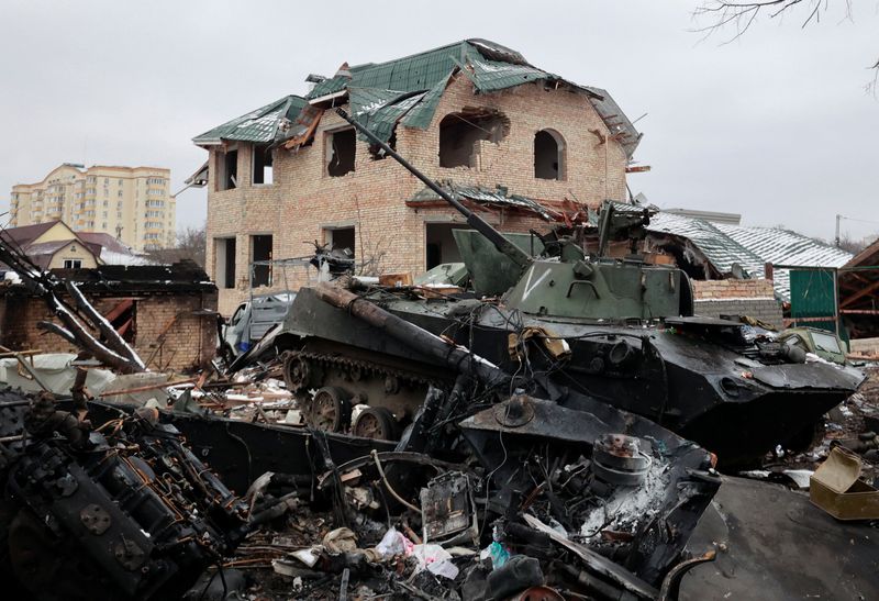 A destroyed armoured vehicle, with the letter "V" painted on its turret, is seen on a street, as Russia's invasion of Ukraine continues, in the town of Bucha in the Kyiv region, Ukraine March 1, 2022. (REUTERS/Serhii Nuzhnenko)