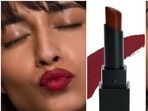 A burgundy lipstick is a classic choice of a makeup item.