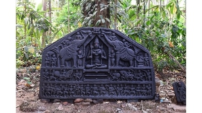 This stone icon with a decorative panel depicting the goddess Gajalakshmi sits in a sacred grove in Kudshe village, Sattari. It finds mention in photographer Pantaleão Fernandes’s latest book, Outdoor Museums of Goa, which focuses on forgotten historical artefacts that dot the state. (Photo courtesy Pantaleão Fernandes) This stone icon with a decorative panel depicting the goddess Gajalakshmi sits in a sacred grove in Kudshe village, Sattari. It finds mention in photographer Pantaleão Fernandes’s latest book, Outdoor Museums of Goa, which focuses on forgotten historical artefacts that dot the state. (Photo courtesy Pantaleão Fernandes)