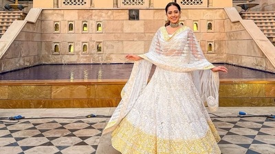 It was teamed with a high-waist ivory organza lehenga that was embroidered in timeless zari while sported a broad golden-hued border. Nushrratt layered the attire with a sheer dupatta suited for the new age tribe. (Instagram/nushrrattbharuccha) It was teamed with a high-waist ivory organza lehenga that was embroidered in timeless zari while sported a broad golden-hued border. Nushrratt layered the attire with a sheer dupatta suited for the new age tribe. (Instagram/nushrrattbharuccha)