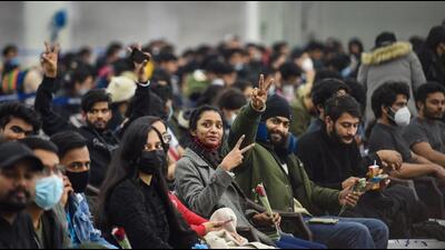 Indian students, evacuated from crisis-hit Ukraine, upon their arrival at the Hindon Air Force Station in Ghaziabad early on Thursday. As part of Operation Ganga, the first IAF C-17 Globemaster aircraft carrying 200 passengers returned to the airbase near Delhi from Bucharest at 1am. (PTI Photo)