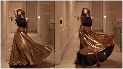 The gorgeous Mouni Roy is always on the go when it comes to work and entertaining her fans. The Naagin fame is an avid social media user and leaves no stone unturned in treating her fans with stunning photos of herself in stylish fits. In her recent Instagram pictures, the Gold actor can be seen flaunting her beautiful metallic skirt as she twirls like a princess. (Instagram/@imouniroy) The gorgeous Mouni Roy is always on the go when it comes to work and entertaining her fans. The Naagin fame is an avid social media user and leaves no stone unturned in treating her fans with stunning photos of herself in stylish fits. In her recent Instagram pictures, the Gold actor can be seen flaunting her beautiful metallic skirt as she twirls like a princess. (Instagram/@imouniroy)