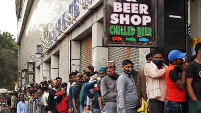 People stand in a queue outside a liquor store in Delhi. (ANI Photo) People stand in a queue outside a liquor store in Delhi. (ANI Photo)